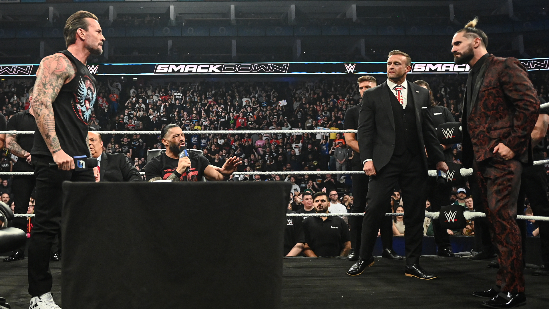 CM Punk Roman Reigns Seth Rollins Paul Heyman Nick Aldis