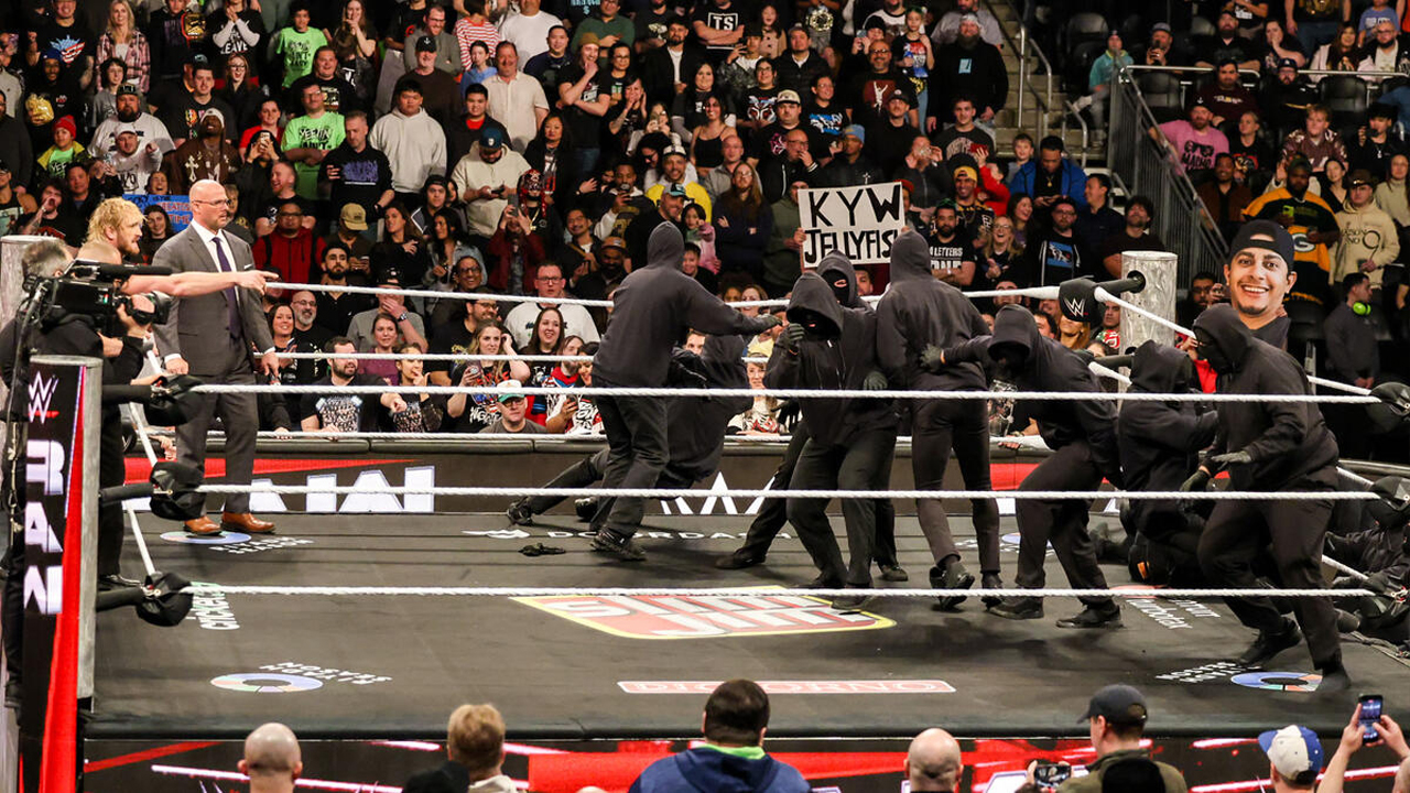 WWE Raw Logan Paul Adam Pearce Seth Rollins Masked Man Masked Men
